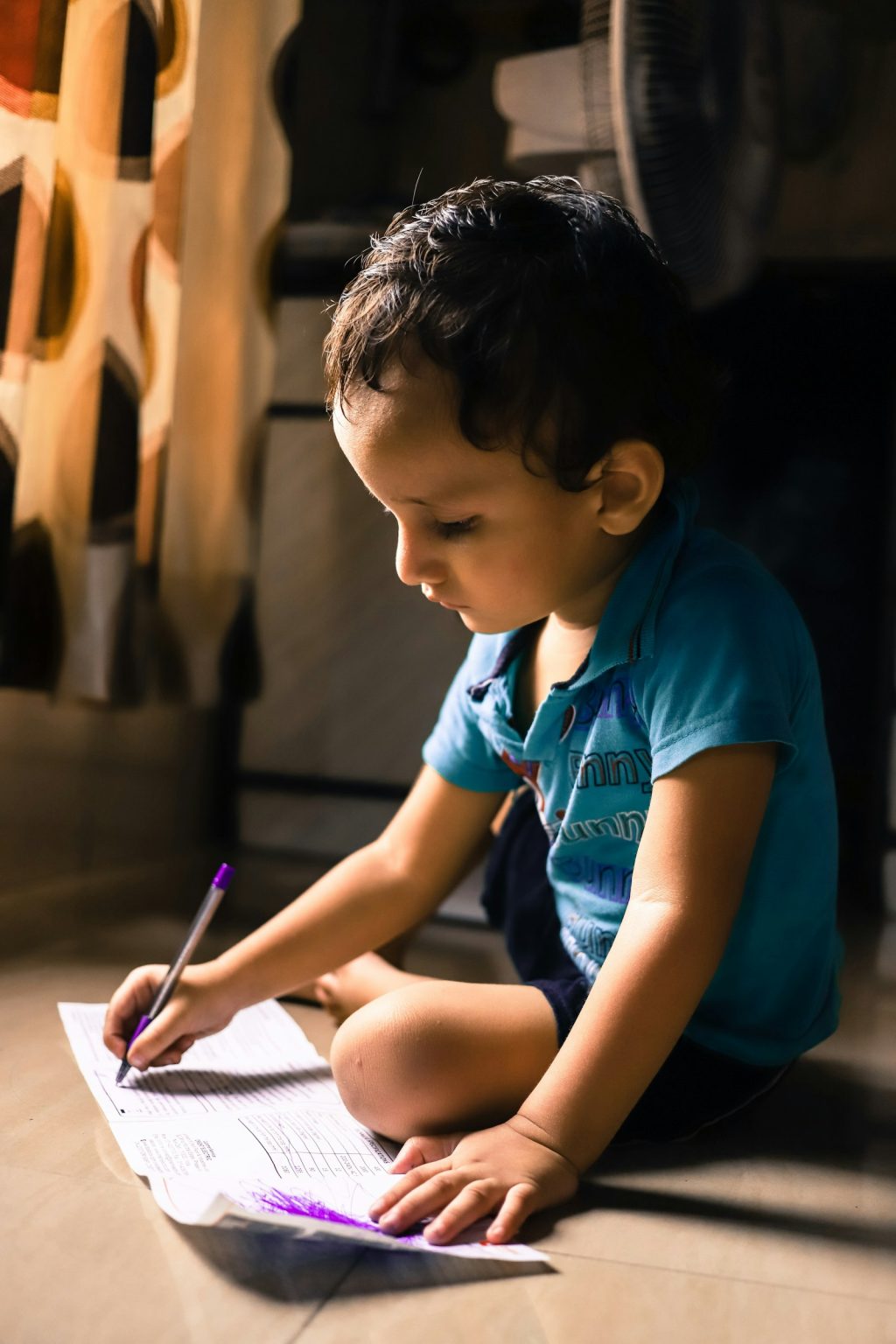 A pupil writing on paper